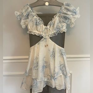 Blue and white floral mini dress/romper. Built in shorts but looks like a dress.